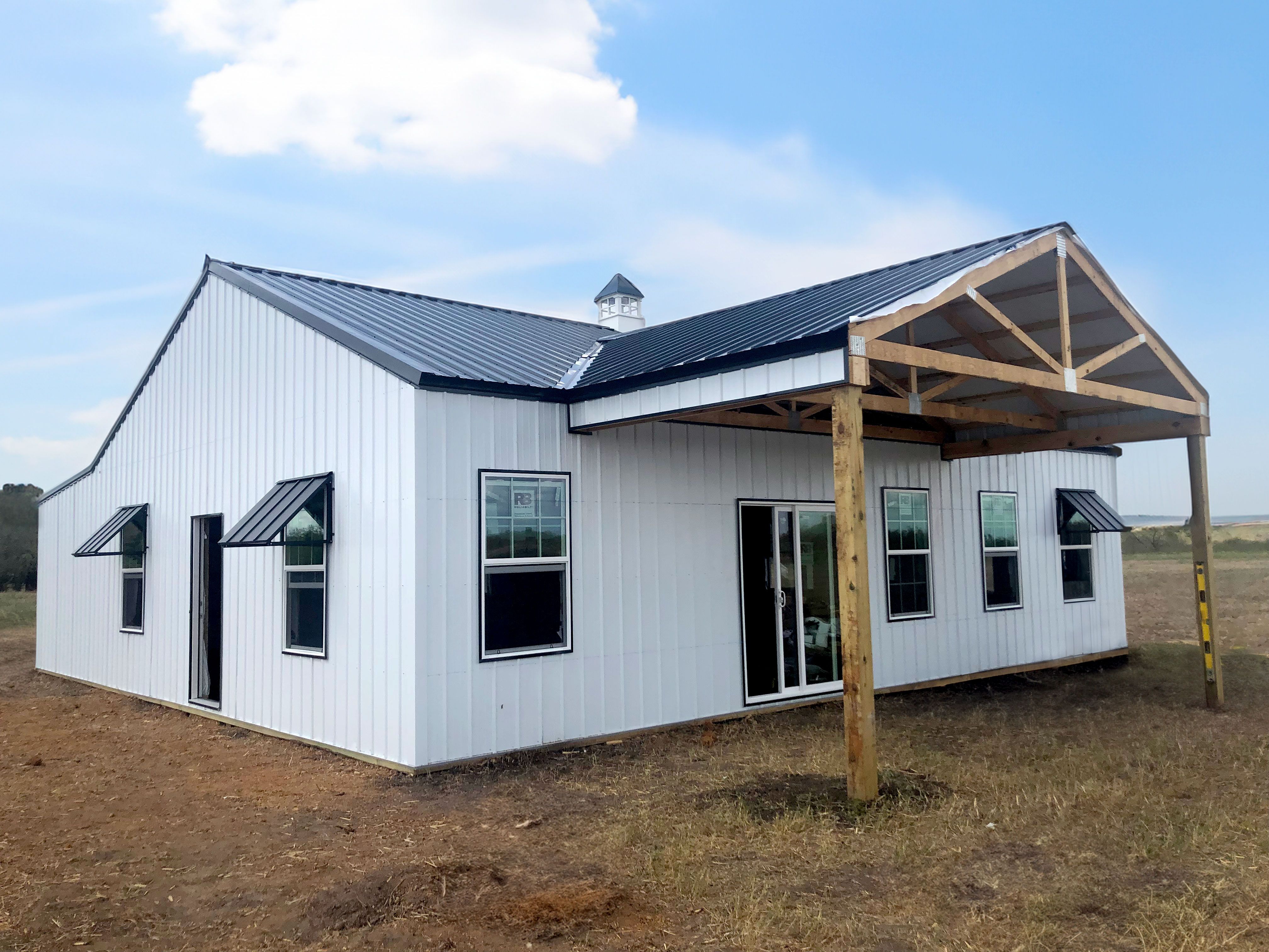 Rhino Pole - Barndominium white with navy blue roofing